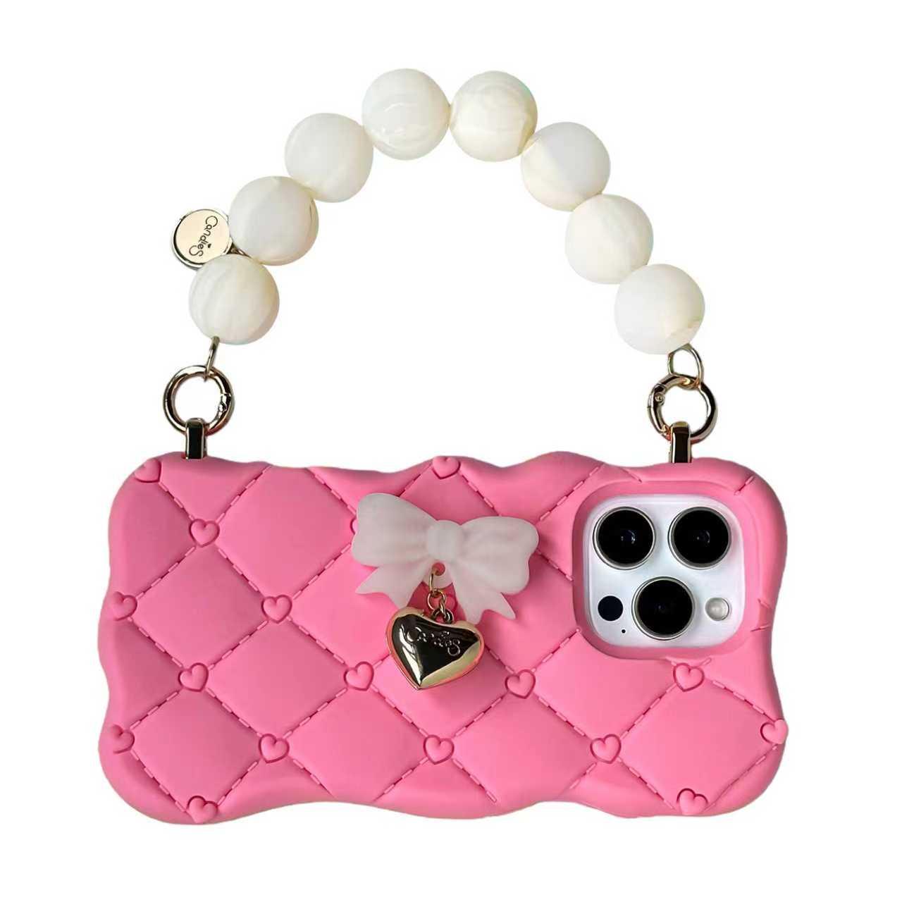 Pink phone case with bow and heart charm on a white background